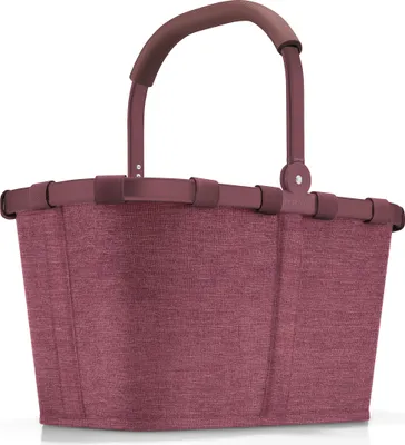 A studio shot of a maroon reisenthel carrybag.