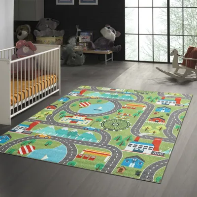 A child's bedroom with a crib and a play rug.