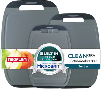A set of three gray cutting boards with black handles, displayed with fruit and marketing labels.