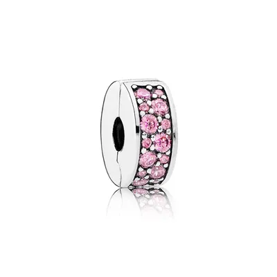 A silver charm with pink stones, set against a white background.