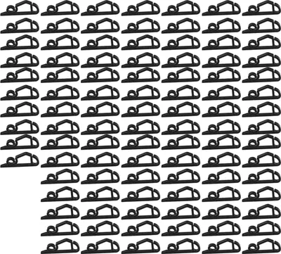 A grid of black plastic clips arranged in rows and columns on a white background.