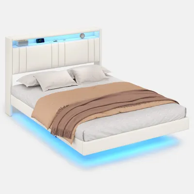 A white bed with LED lighting and a brown blanket.
