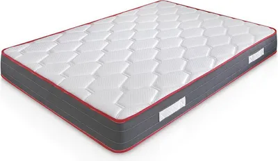 A mattress is shown from a slightly elevated side angle against a white background.