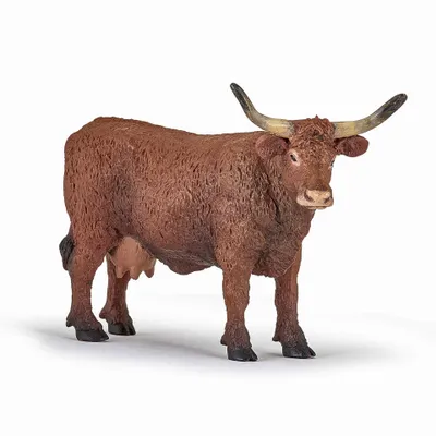 A brown cow figurine with large horns stands on a white background.