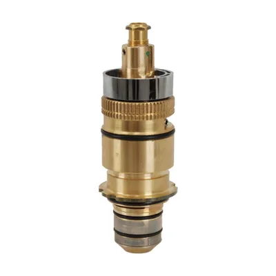 A close-up studio shot of a brass faucet cartridge against a white background.