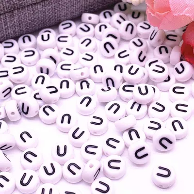 Produktbild von Buchstaben Perlen, 30 Stück, 4x7 mm, weiß mit schwarz, rund, Buchstabe U