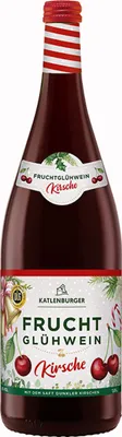A bottle of cherry mulled wine with festive Christmas decorations.