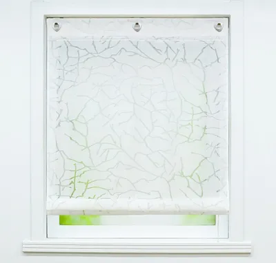 A white window frame with a white roller blind featuring a light green branch pattern.