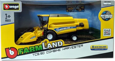 A toy combine harvester is displayed in its retail packaging.