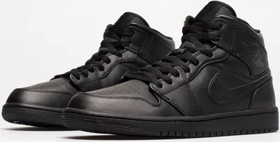 A pair of black Nike Air Jordan 1 Mid sneakers.