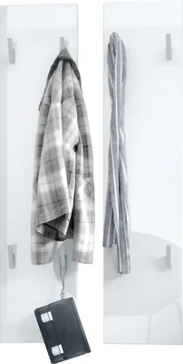 A close-up view of a white high-gloss coat rack system with a plaid jacket, a scarf, and a black briefcase hanging on it.