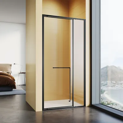 A modern shower enclosure with a black frame and glass doors, set in a bathroom with tiled walls and a view of a coastal landscape through a large window.