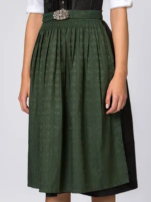Close-up of a woman wearing a traditional German dirndl skirt.