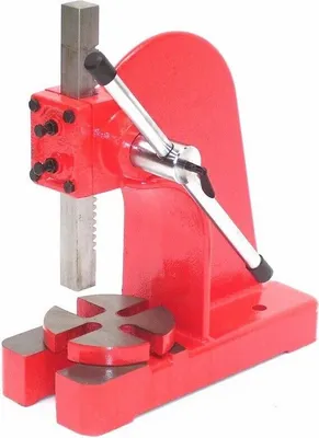 A red workshop press with a silver lever and ram, set against a white background.