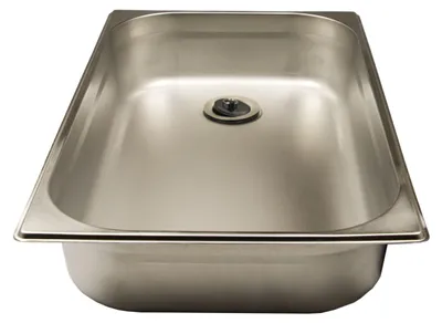 A stainless steel sink with a drain.