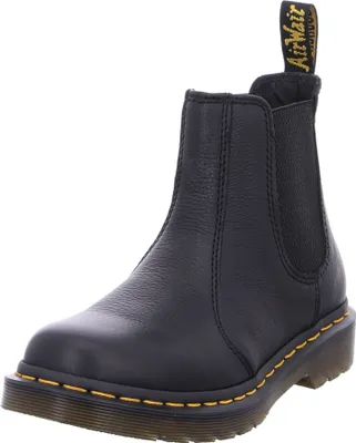A black Dr. Martens Chelsea boot is shown against a white background.