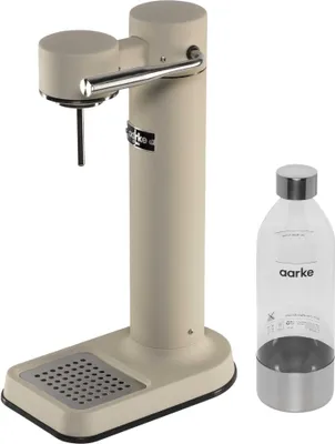 A sand-colored Aarke Carbonator 3 water carbonator and a clear PET bottle with a silver base and cap are shown against a white background.