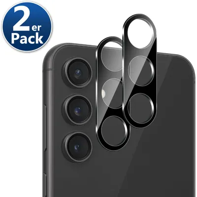 A close-up view of a smartphone's camera array with two camera lens protectors placed on top.