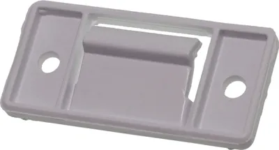 A white plastic part for a refrigerator or freezer.