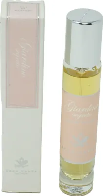 A perfume bottle and its packaging are displayed side-by-side against a white background.