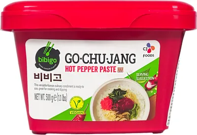 A red tub of Bibigo Gochujang Hot Pepper Paste.