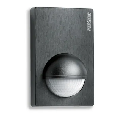 A close-up studio shot of a black motion sensor.
