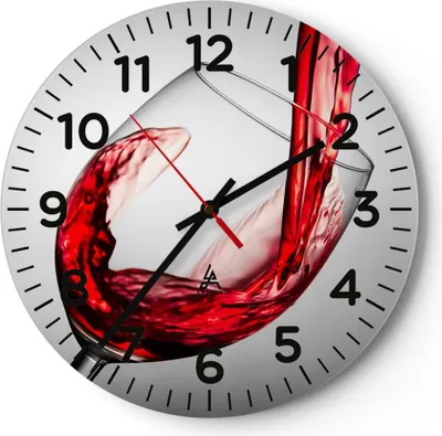 A round clock with a picture of red wine being poured into a glass.