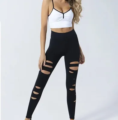 Productafbeelding van Bum lift sportset, model "Melody", met scheurdetails, in de kleuren wit en zwart, maat S