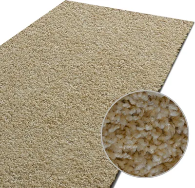 A close-up view of a beige shaggy rug with a magnified inset showing the texture of the fibers.