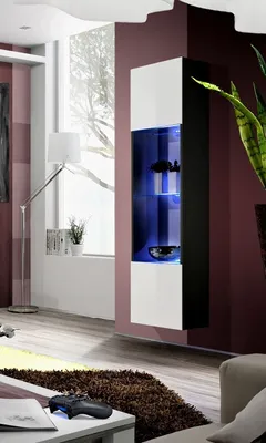 A modern living room with a wall-mounted display cabinet.