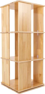A freestanding, rotating bookshelf with three tiers, made of light-colored wood.