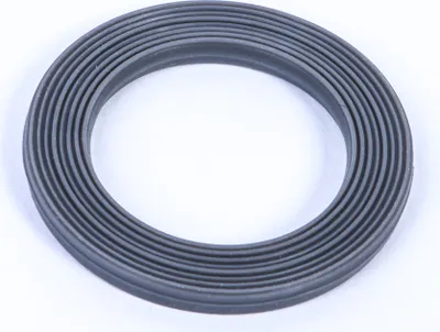 A close-up studio shot of a gray rubber gasket with ribbed texture, isolated on a white background.