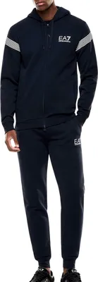 A man wearing a navy blue EA7 tracksuit.