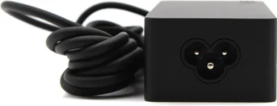 A black power adapter with a coiled power cord on a white background.