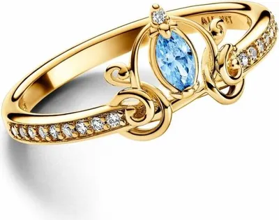 A close-up studio shot of a gold ring with a blue gemstone and small white diamonds.