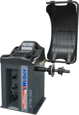 A wheel balancing machine in a studio setting.