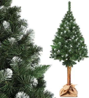 A close-up of a Christmas tree on the left and a full artificial Christmas tree on a stand on the right, both with artificial snow.