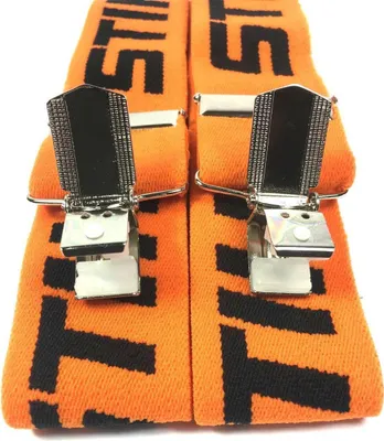 A close-up view of two orange suspenders with black lettering and silver clips.