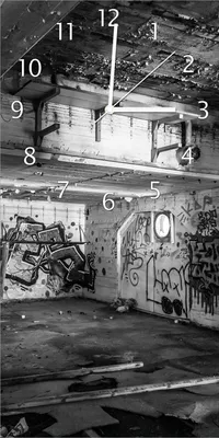 Produktbild von Wallario Design Wanduhr bedruckt, Größe 30 x 60 cm, Motiv: Alte verlassene Fabrik in schwarz weiß mit Graffiti