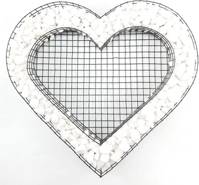 A heart-shaped wire frame filled with white stones.