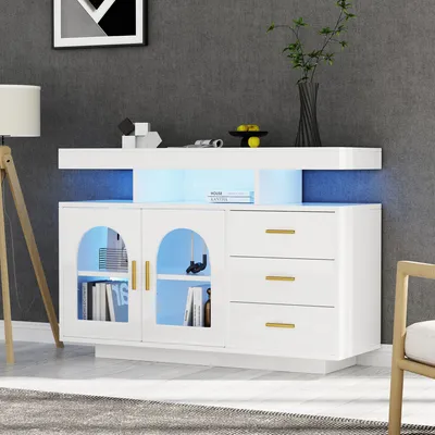 A white sideboard with LED lighting in a modern living room setting.