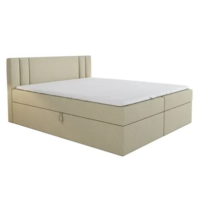 A beige boxspring bed with a white mattress and a headboard, shown from a side angle against a white background.