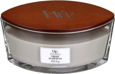 A WoodWick Fireside scented candle in a glass jar with a wooden lid.