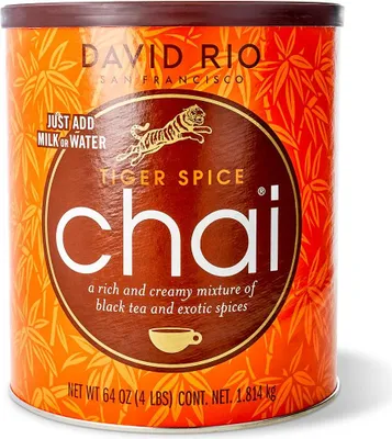 A cylindrical container of David Rio Tiger Spice Chai mix.