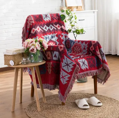 Imagen del producto de Manta de algodón tejida con flecos, ideal para sofá o cama