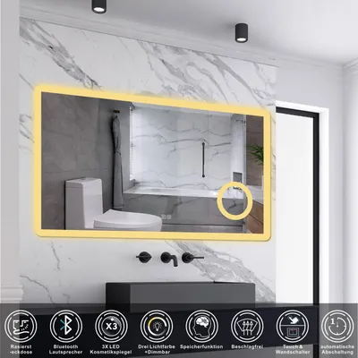 A modern bathroom with a large LED mirror reflecting a toilet and bathtub.