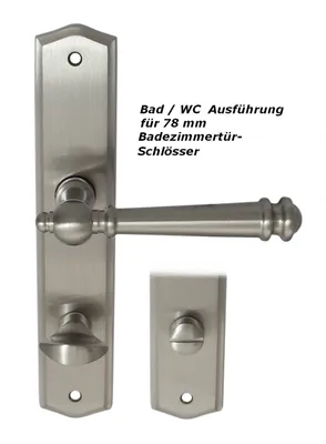 A set of brushed nickel door handles and a lock mechanism for a bathroom or WC door.