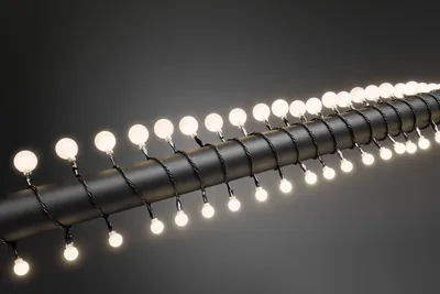 Produktbild von Konstsmide - LED Globelichterkette, kleine & große runde Dioden, 80 warm weiße Dioden, 24V Außentrafo, schwarzes Kabel; 3680-107