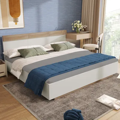 A bedroom scene with a bed, desk, and chair.