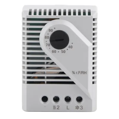A white mechanical hygrostat with a dial for humidity control.